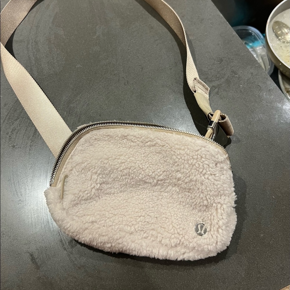 Lululemon everywhere fleece belt bag in natural/ivory.